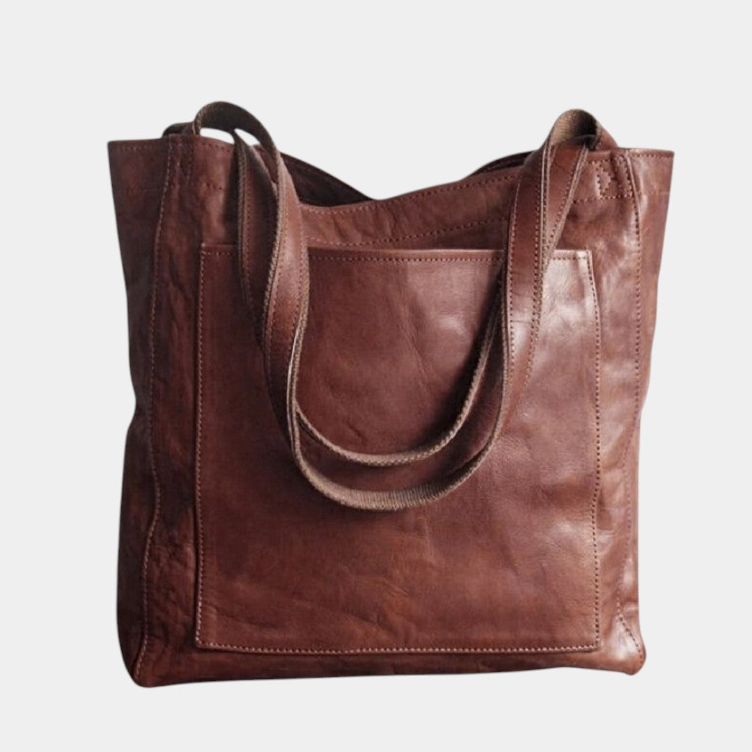 Women’s elegant leather handbag in premium PU material with spacious compartments and timeless design, ideal for daily wear or formal occasions