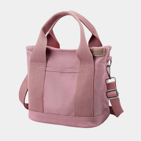 Women’s stylish canvas shoulder bag with adjustable strap and multiple compartments, perfect for everyday use
